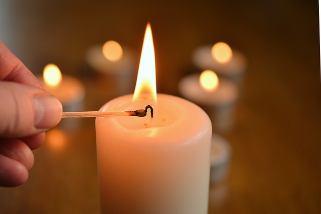 Memorial candle representing shared memories and tributes